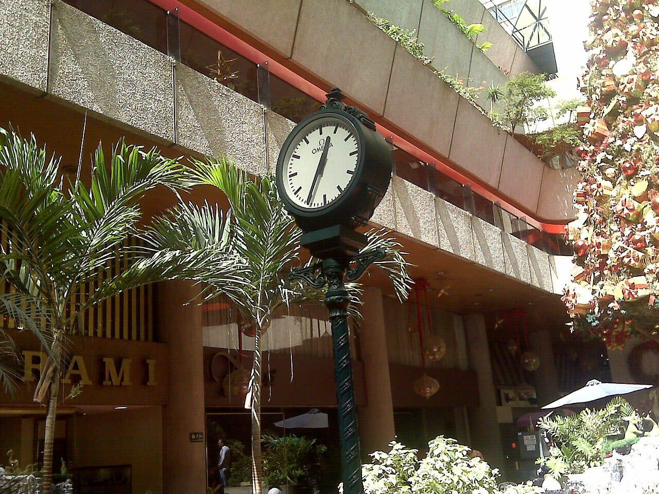 A street clock in front of the planted, stepped concrete terraces of the Paseo Las Mercedes shopping centre in Caracas